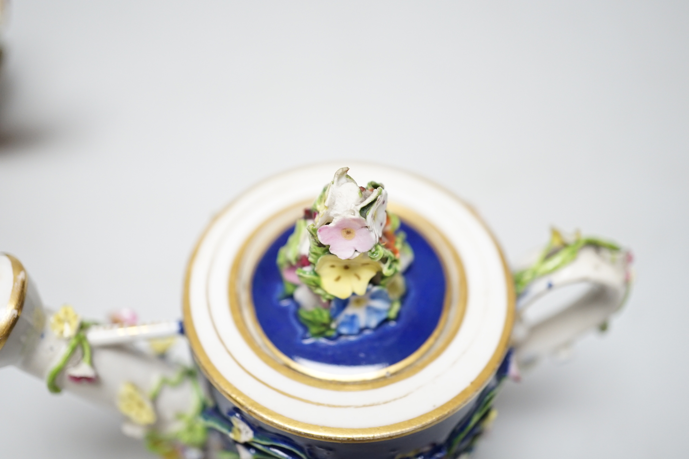 Two Derby porcelain floral encrusted miniature water sprinklers, circa 1825, tallest 10cm